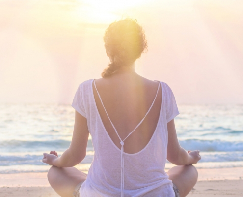 woman on beach - samsara healthy holidays